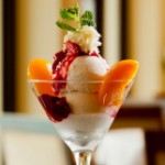 Peach melba with raspberry coulis
